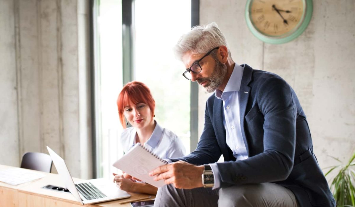 business-people-in-the-office-consulting-a-project-2021-08-26-12-07-43-utc-min.jpg