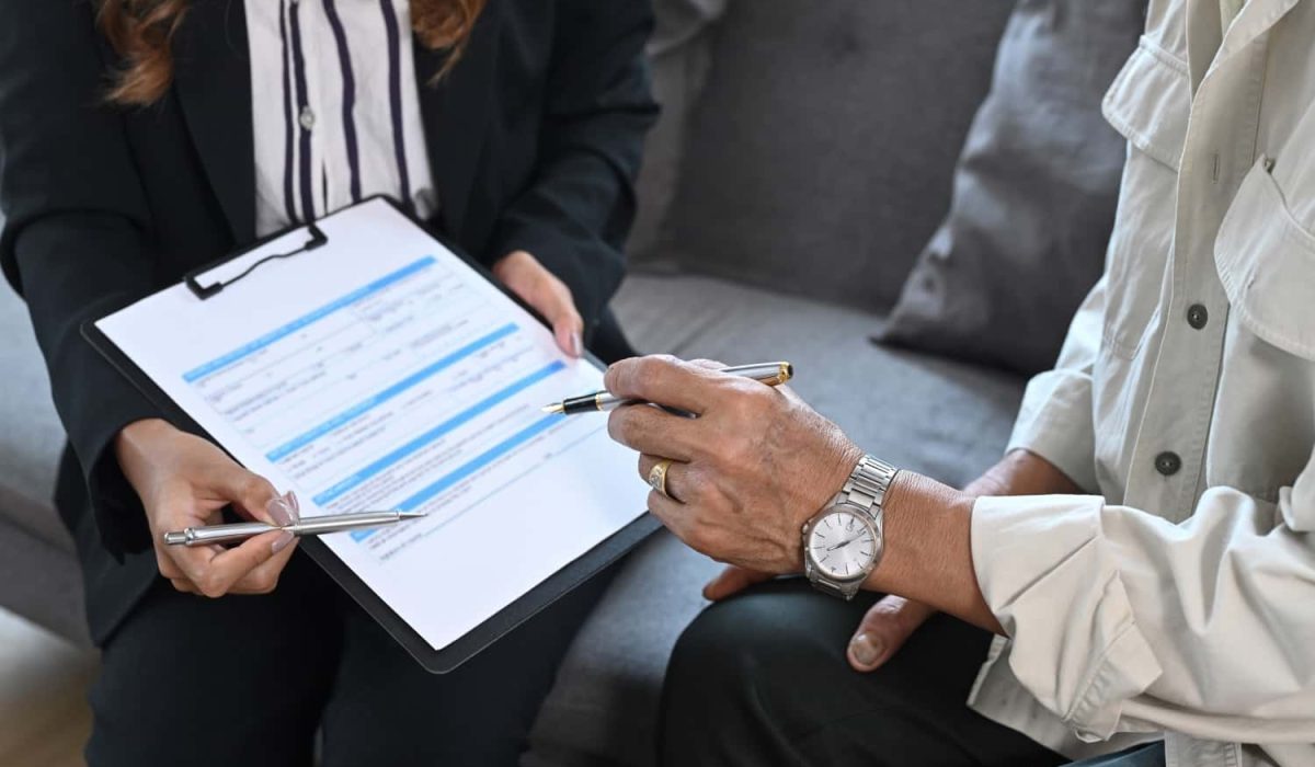 cropped-shot-of-elderly-man-sitting-in-insurance-a-2022-04-19-04-03-25-utc-min.jpg